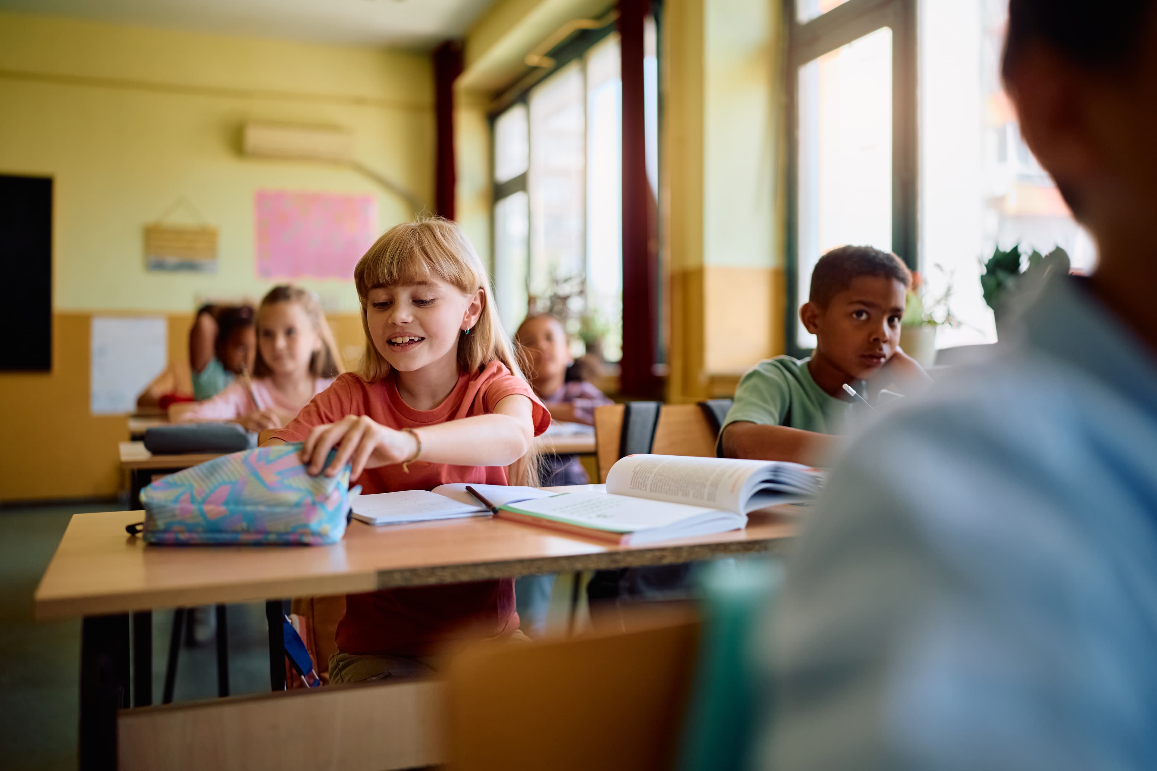 happy girl and her classmates